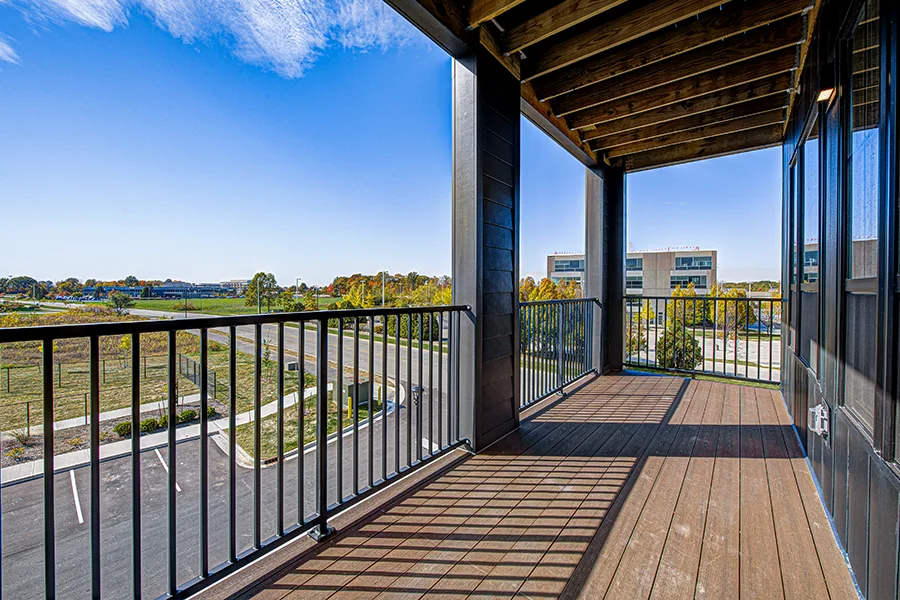 A view from a balcony at The State at Fishers looking toward the surrounding community